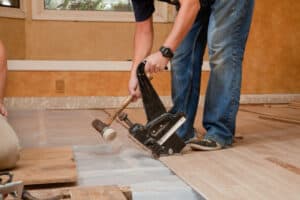 floor being installed by a carpenter.